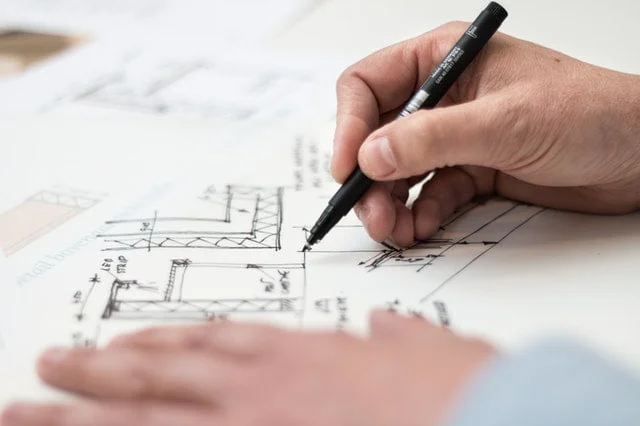 Architect drawing floor plans by hand